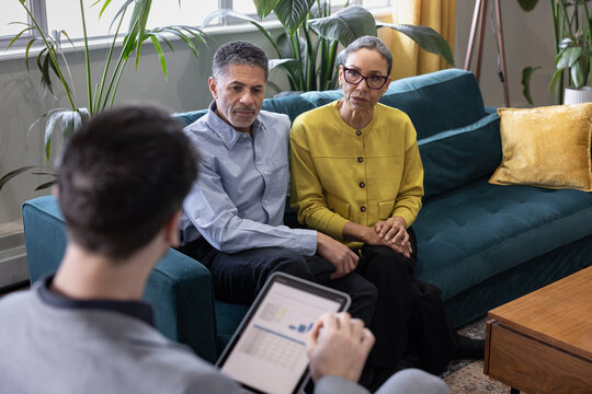 Senior Couple Seeking Financial Guidance in Professional Setting