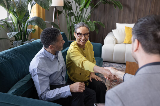 Senior Couple closing contract with a real estate agent