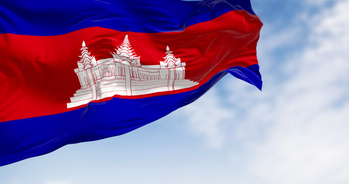 Cambodia national flag waving. Three bands, blue, double red, blue, with Angkor Wat in white centered on the red. 3d illustration render. Fluttering fabric. Selective focus