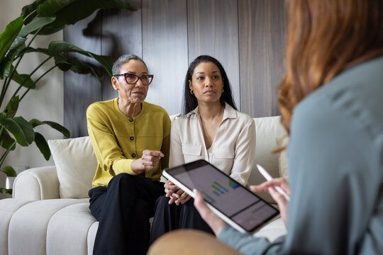 Mother and daughter in a meeting with a financial advisor
