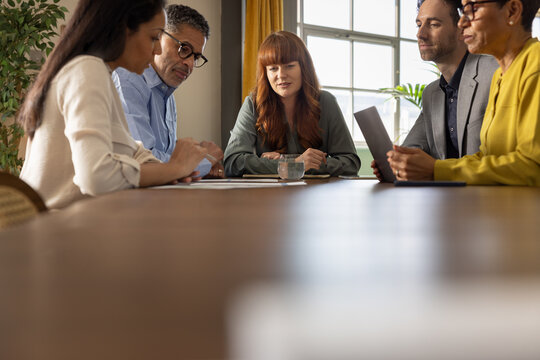 Diverse team engaged in a strategic business discussion