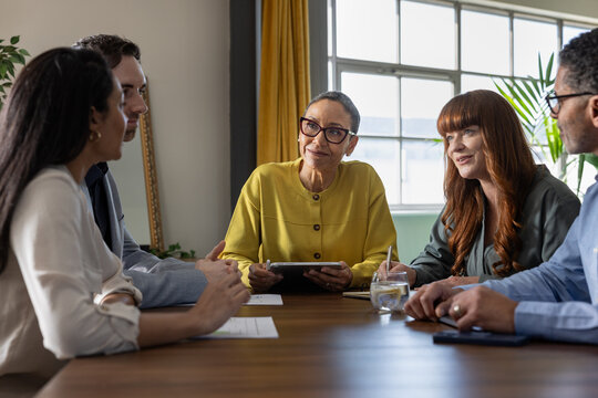 Senior businesswoman leading a team meeting