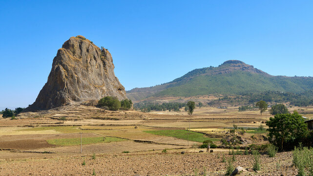 Giant rock monolith iat the cultivated field in Ethiopian countryside
