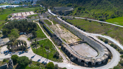 Obraz premium Aerial Panoramic View of the Column-Lined Street and Ancient Roman Ruins in Perge, Antalya, Turkey