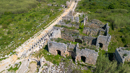 Naklejka premium Aerial Panoramic View of the Column-Lined Street and Ancient Roman Ruins in Perge, Antalya, Turkey