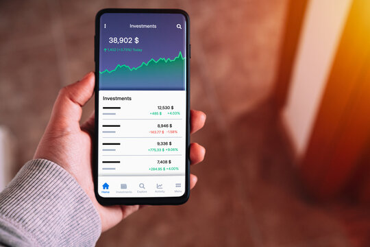 Investment App on Smartphone. Stock Market Portfolio Tracking on Mobile Screen. Banking, personal finance, and online trading.