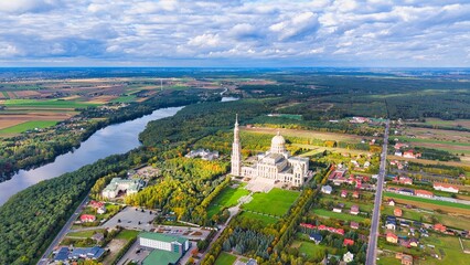 Obraz premium Drone panorama of Licheń Stary with Basilica of Our Lady of Licheń, lakes and rural landscape, Poland