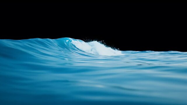 Dynamic blue ocean wave cresting with calm water foreground