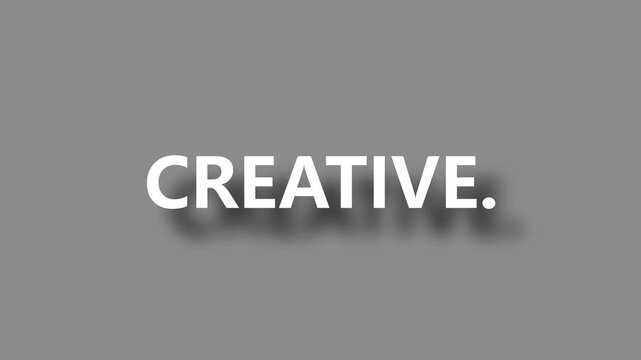 Creative word reveal animation with soft drop shadow and gray background motion graphics.