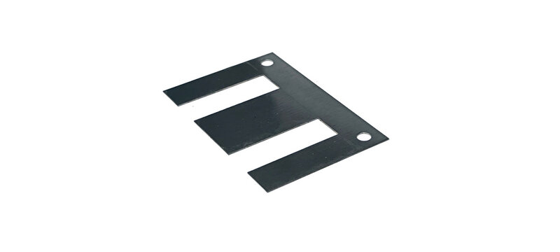 Ferrite core for transformers on a white background.