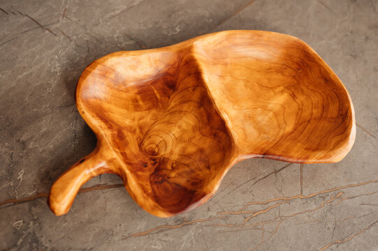 Hand Carved Wooden Serving Bowl Showcasing Warm Grain And Organic Leaf Silhouette, Handcrafted By Artisan