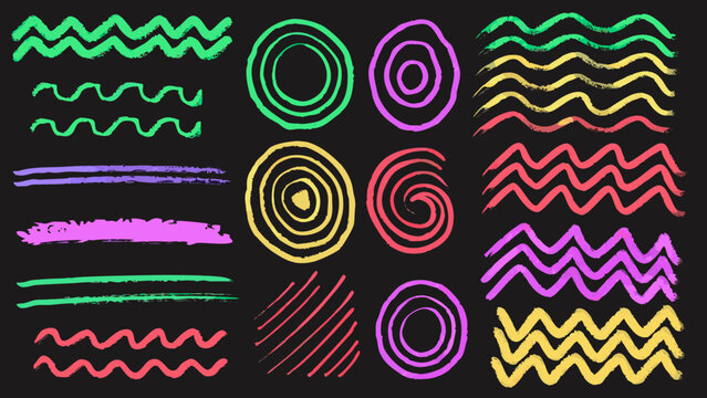 Colorful chalk scribbles and shapes arranged on a black background