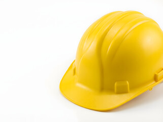 Fototapeta premium Bright yellow hard hat on white background safety first
