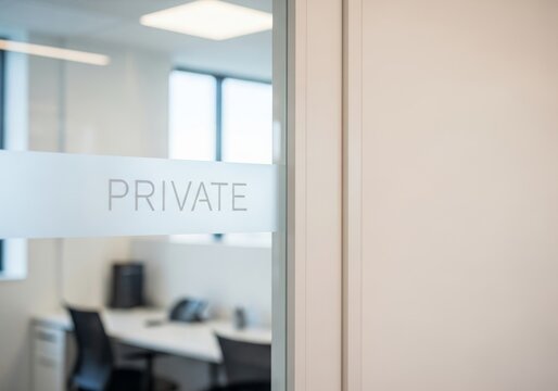 Private office interior through glass door in modern building