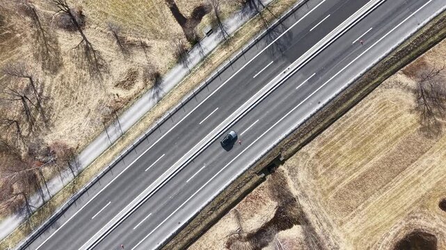 Drone view of a highway on  agricolture field in the Swiss alps
