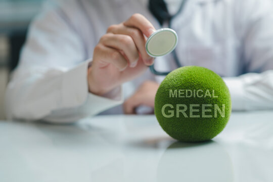 Green medical: Safe and environmentally friendly medical treatment. A global healthcare and medical concept featuring a green health checkup Stethoscope.