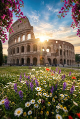 Obraz premium Colosseum in Rome with blooming wildflowers and bougainvillea