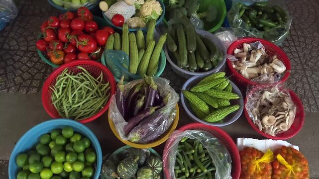 vegetables on the market, Top view of assorted fresh fruits and vegetables in colorful baskets at local market, tropical produce and healthy food concept.