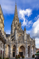 Fototapeta premium Church of Saint-Maclou in Rouen, France. Flamboyant Gothic facade view under a partly cloudy sky