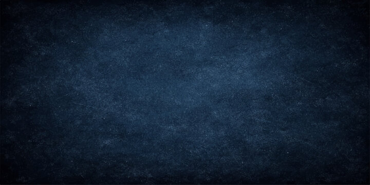 Dark blue grunge textured background with rough vintage wall pattern and chalkboard style surface