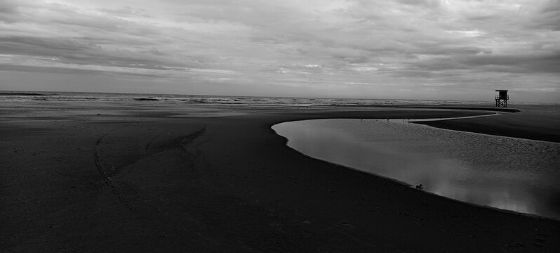 black and white photograph of the beach