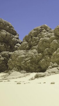 Sunlight bathes the rugged rocks, casting shadows on the soft sand. The tranquil scene captures natures beauty, inviting exploration and adventure in a serene locale.