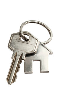 Close-up of keys attached to a home-shaped key chain against black