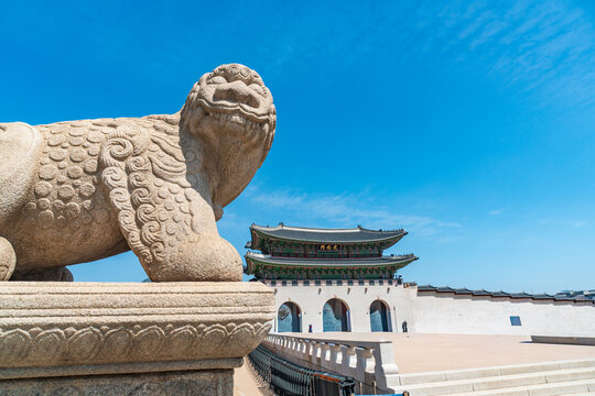 Seoul, South Korea - Apr. 12, 2026 : Haetae Statue and Gwanghwamun Gate under Blue Sky, Seoul, South Korea