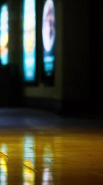 Bright neon lights reflect off polished floors in an exciting urban space. The colorful signage creates a lively atmosphere during a bustling evening. The scene captures the essence of nightlife.