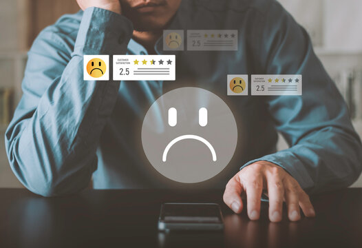 Bad review, low score, client dissatisfaction, reputation risk. Negative customer satisfaction concept, low rating and sad feedback. Man reviewing poor service experience on smartphone