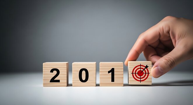 Hand turns wooden block from 201 to target symbol on gray background