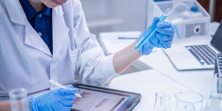 Woman scientist person research writing document science study datum in modern laboratory, professional female doctor working on medical test lab note report health technology development analysis