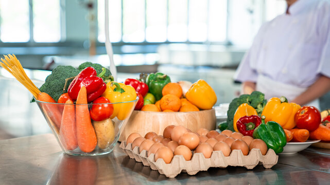 Fresh ingredients for food preparation in commercial kitchen, vegetables eggs and meal prep setup for healthy cooking, restaurant workflow, and culinary business visuals