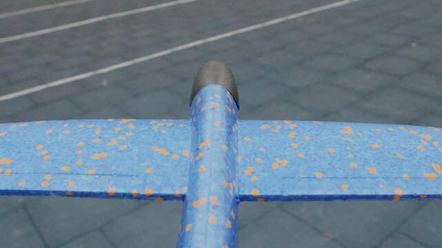 Close view of foam wing surface. Macro shot showing textured foam and dots. Zoomedin image of airplane wing with worn foam details