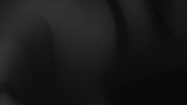 Black and gray abstract gradient blurry shapes evoke a monochromatic dance suitable for backgrounds, graphic design, art projects, and web design.