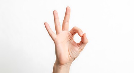 Naklejka premium Hand gesture forming a circle with thumb and index finger isolated on white background