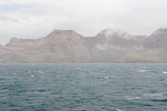 South Georgia landscape with sea on a cloudy winter day.