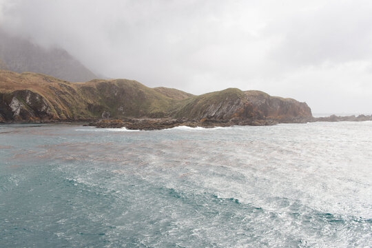 South Georgia landscape with sea on a cloudy winter day.