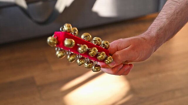 Man Shaking Sleigh Bells Close Up