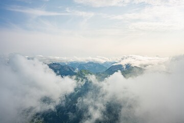 Naklejka premium View from Thaneller Summit towards Galtjoch and Kelmer Spitze, Green Mountain Peaks Rising Above a Sea of Clouds, Atmospheric Alpine Landscape, Lechtal Alps, Tyrol, Austria, Europe