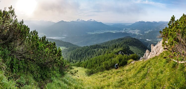Alpine Panorama of the Thaneller North Face near Reutte, Hiker on an Off-Grid Ridge Crossing without Official Trails, Scenic View over the Lechtal Valley and Tyrolean Alps, Austria