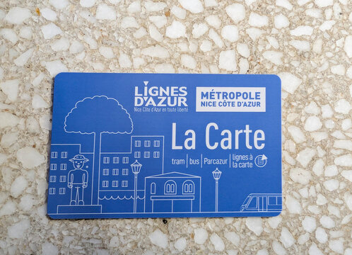 Nice, France, March 24, 2025. Top view of a Nice public transport card "La Carte" on a textual background.