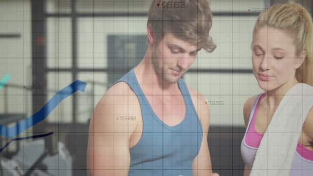 Vertical video: Checking tablet, fit man and woman in gym clothes leaning at gym reviewing metrics