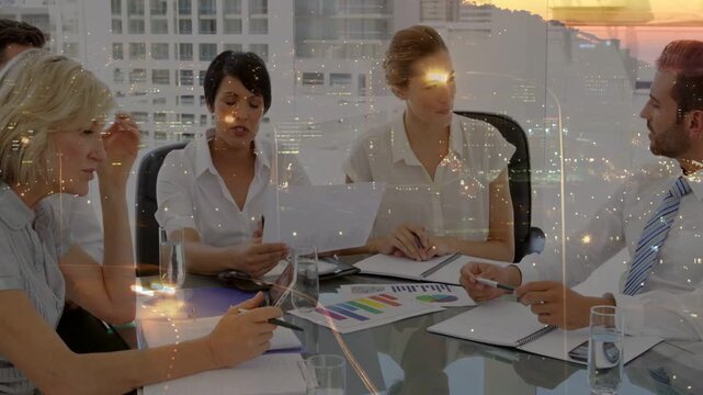 Speaking man gesturing toward chart at upper office, business team taking notes planning next steps