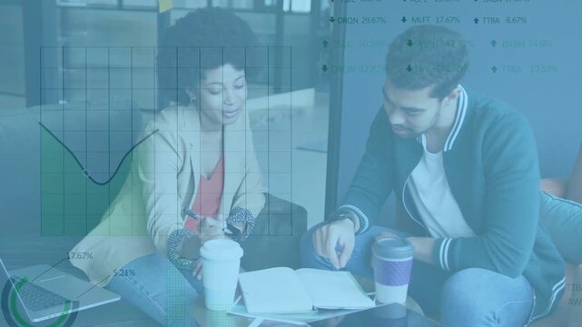Pointing and reviewing woman in beige blazer and man in varsity jacket over notebook, chart overlay