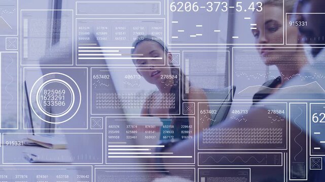 HUD appearing, three teammates reviewing laptop or tablet data at meeting table, wearing business we
