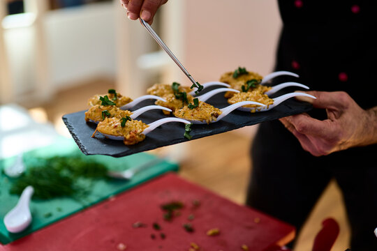 Risotto. Chef preparing small tapas for a risotto tasting at a restaurant