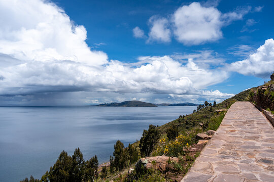 Stone path overlooking nature and terraces on Taquile Island, Lake Titicaca