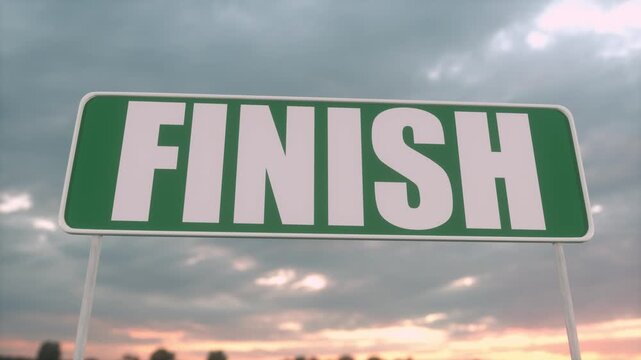Finish Line Road Sign Against Dramatic Cloudy Sky at Sunset