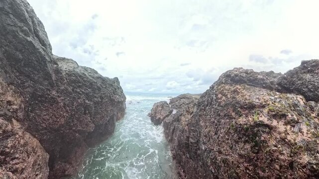 Powerful waves crash against the rocky shore of Torio, Panama.